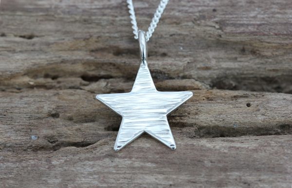 Sterling silver line hammered mini star pendant