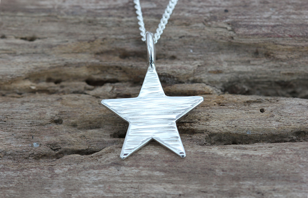 Sterling silver line hammered mini star pendant