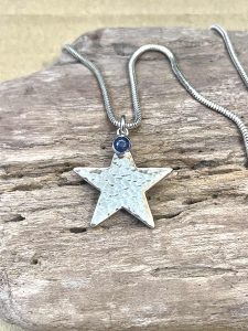 A silver star necklace made by Aimi as a commission piece
