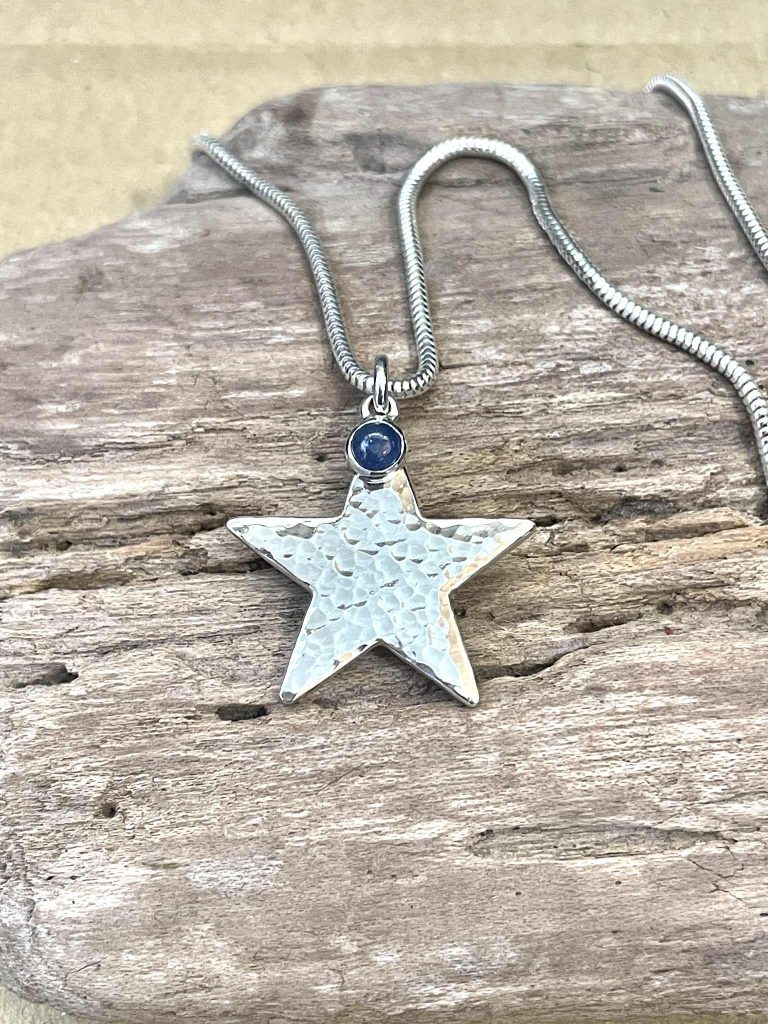 A silver star necklace made by Aimi as a commission piece
