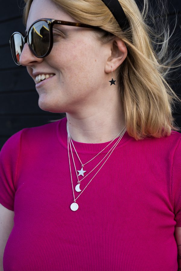 Insilver models - finals Handmade sterling silver layered pendants: line hammered star, plain crescent moon and glitter hammered full moon disc. Model wears star drop earrings.