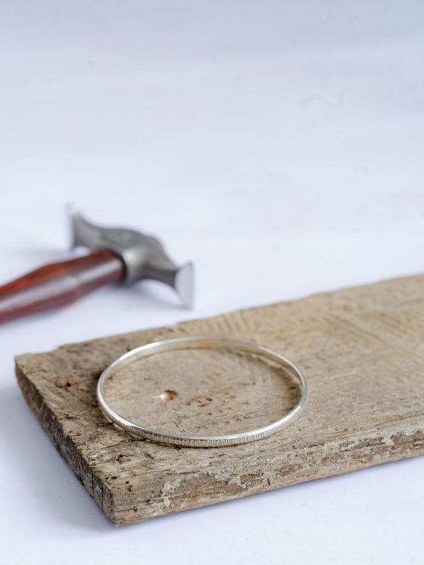 D-profile bangle, line hammered texture, workshop