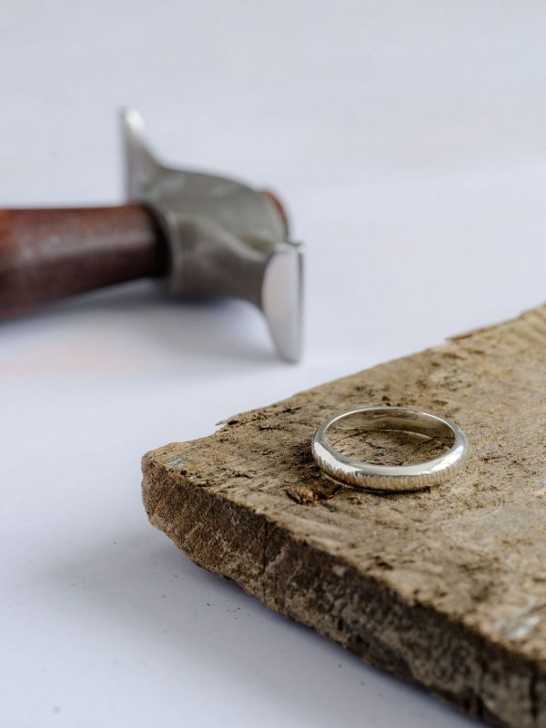 Traditional D-shape ring, line hammered band